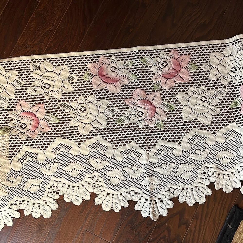 Cream and pink colored fireplace mantel cover
